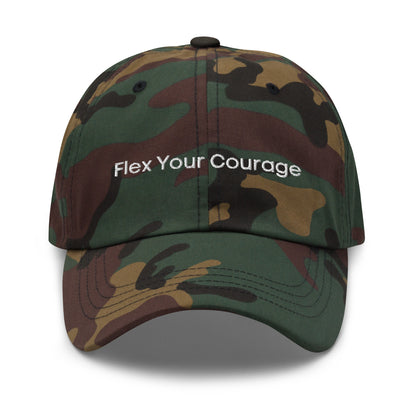 A camo dad hat with the phrase "Flex Your Courage" embroidered in white stitching across the front.