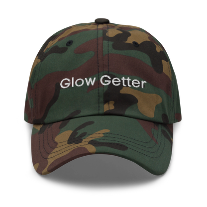 Camo baseball cap with white embroidered text 'Glow Getter' on the front.