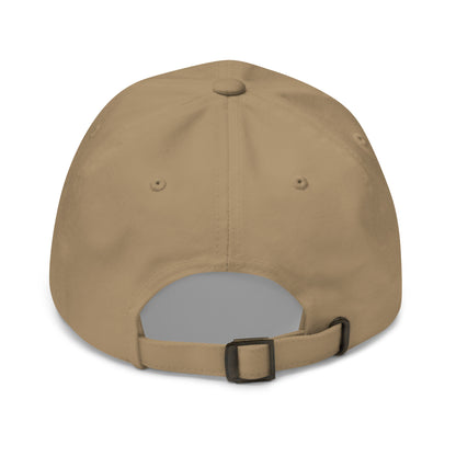 The image shows the back view of a khaki dad hat featuring an adjustable strap with a metal buckle for sizing.