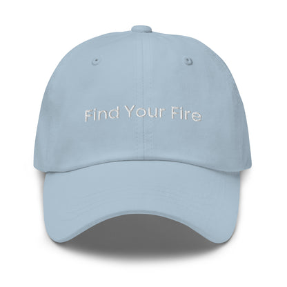 A light blue dad hat with the phrase "Find Your Fire" embroidered in white stitching across the front.