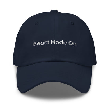 A dark blue dad hat with the phrase "Beast Mode On" embroidered in white stitching across the front.