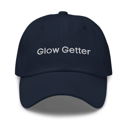 Navy blue baseball cap with white embroidered text 'Glow Getter' on the front.