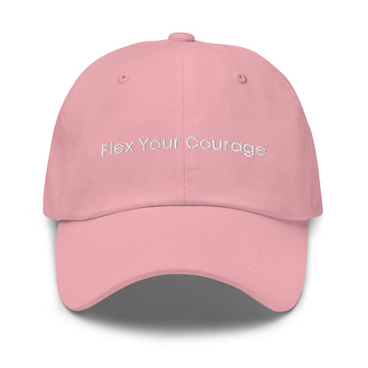 A pink dad hat with the phrase "Flex Your Courage" embroidered in white stitching across the front.