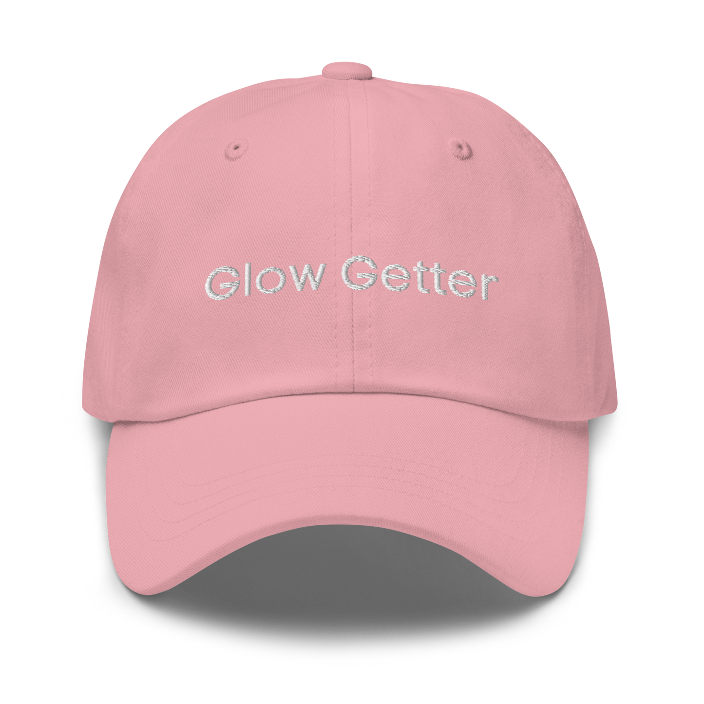 Pink baseball cap with white embroidered text 'Glow Getter' on the front.