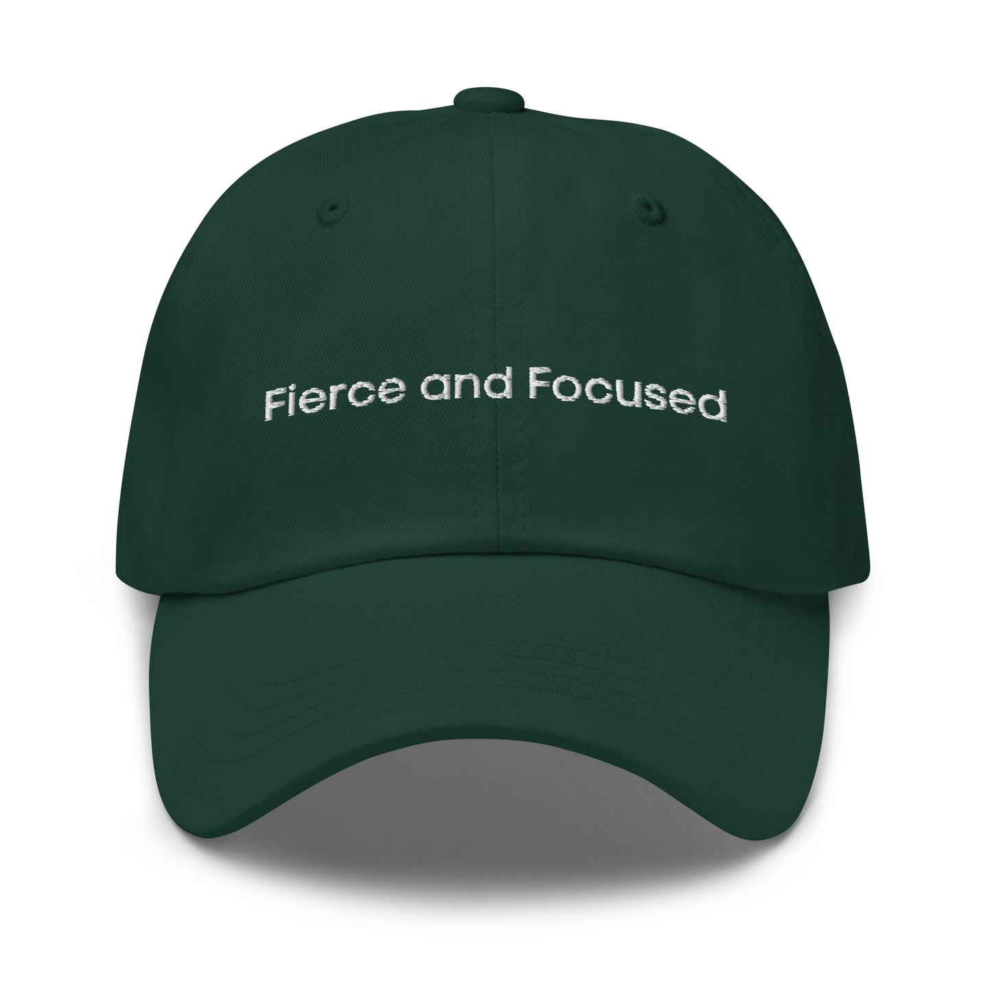 A dark green dad hat with the phrase "Fierce and Focused" embroidered in white stitching across the front.