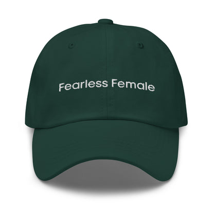 A dark green dad hat with the phrase "Fearless Female" embroidered in white stitching across the front.