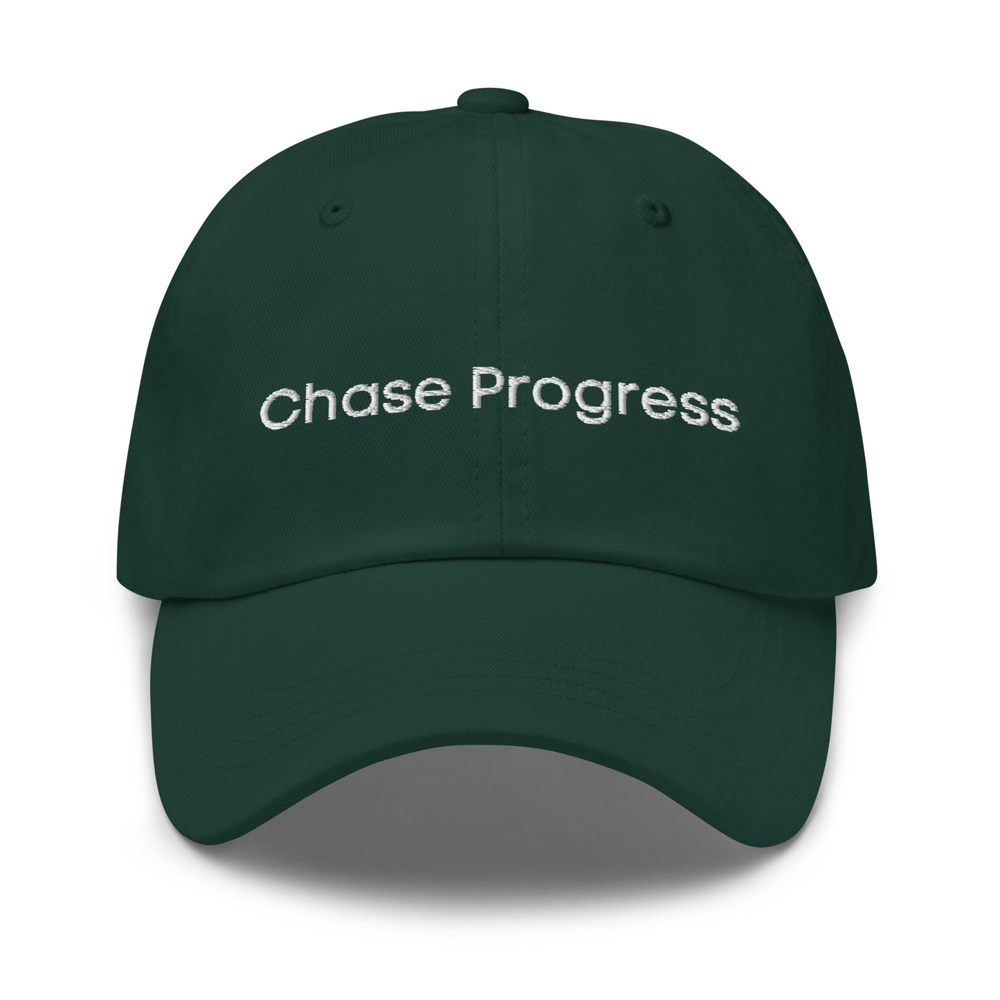 A green dad hat with the phrase "Chase Progress" embroidered in white stitching across the front.