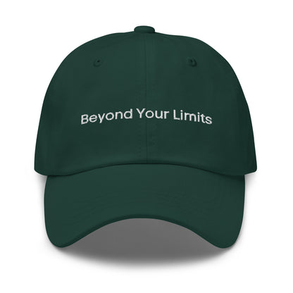 A green dad hat with the phrase "Beyond Your Limits" embroidered in white stitching across the front.