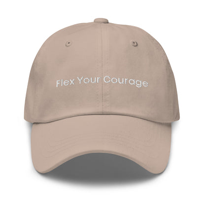 A stone dad hat with the phrase "Flex Your Courage" embroidered in white stitching across the front.