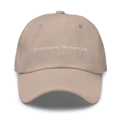 A stone dad hat with the phrase "Empowered Women Lift" embroidered in white stitching across the front.