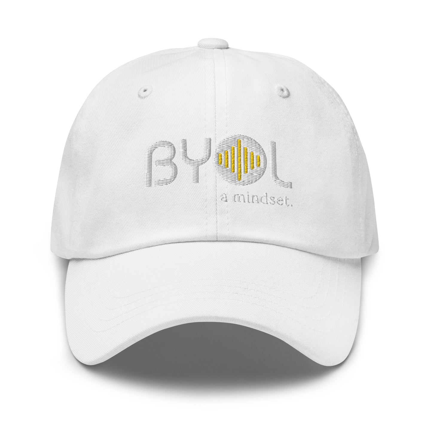 White classic dad hat with "BYOL a mindset" embroidered on the front in white and yellow, displayed against a clean background. Available in various colors: black, gray, green, pink, and tan.