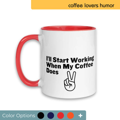 White coffee mug with a red handle, humorously printed with "I'll Start Working When My Coffee Does" and a peace sign graphic, designed for coffee lovers, displayed with a selection of color customization options.