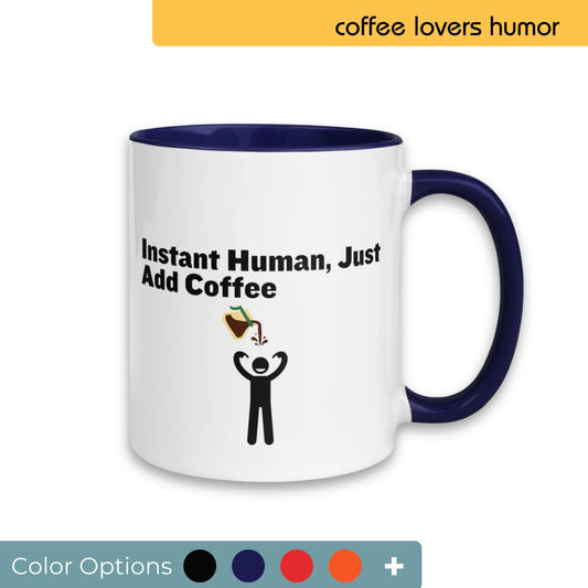 White coffee mug with navy blue handle and interior, featuring the playful phrase "Instant Human, Just Add Coffee" and a graphic of a stick figure receiving a coffee pour, perfect for coffee enthusiasts, available with various color customization options.