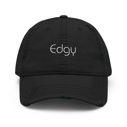 A front view of a black distressed baseball cap with the word "Edgy" embroidered in white on the front panel, featuring a frayed brim and distressed details for a worn, stylish look.