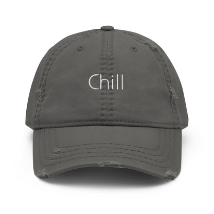 A grey dad hat with a slightly distressed brim and crown, featuring the word "Chill" embroidered in white on the front.