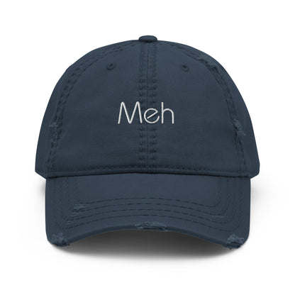 A navy blue dad hat with a slightly distressed brim and crown, featuring the word "Meh" embroidered in white on the front.