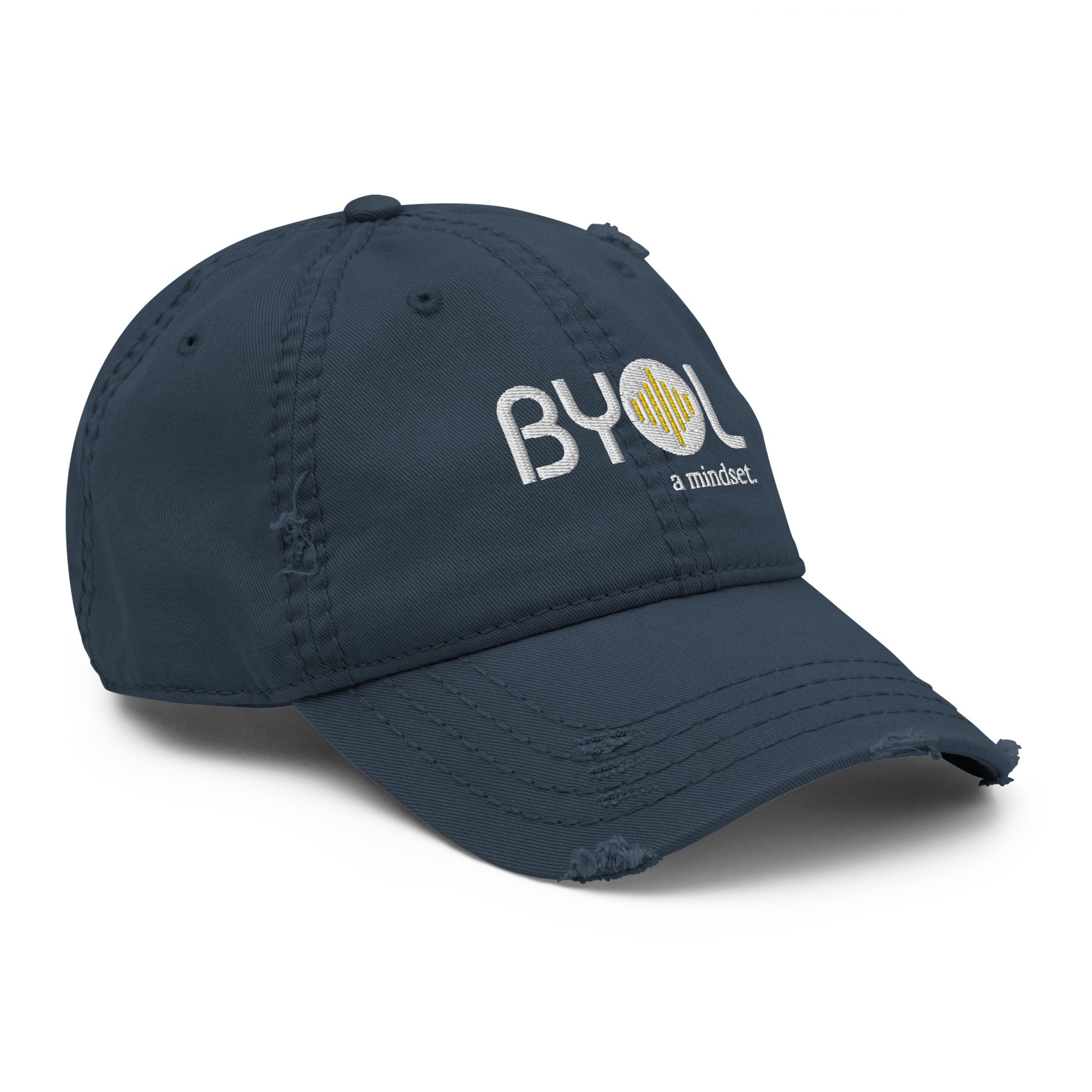 Navy blue distressed dad hat with "BYOL a mindset" embroidered on the front in white and yellow, featuring intentional wear and tear details, displayed against a clean background. Available in various colors: black, navy blue, gray, green, and beige.