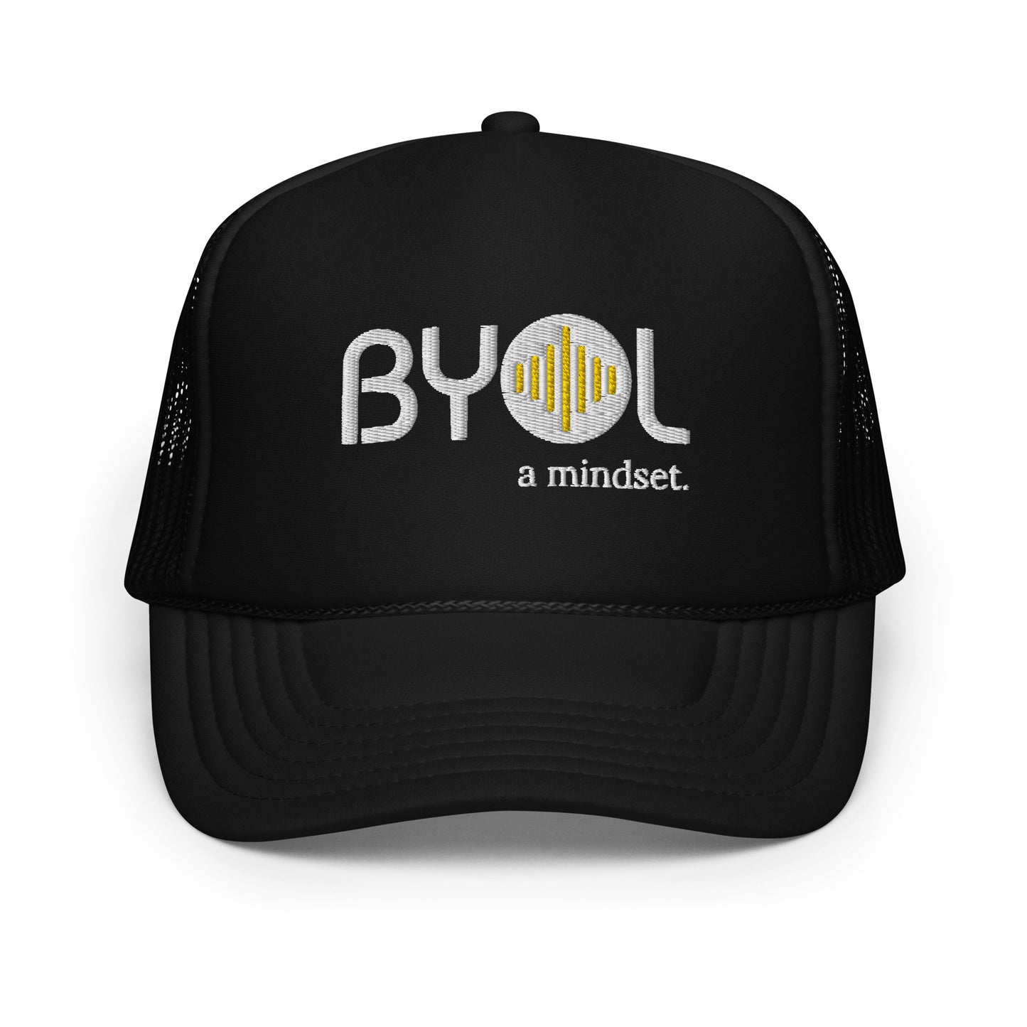 Black on black foam trucker hat with "BYOL a mindset" embroidered on the front in gray and yellow, displayed against a clean background. Available in various colors: black, white and blue, blue, pink, and white.