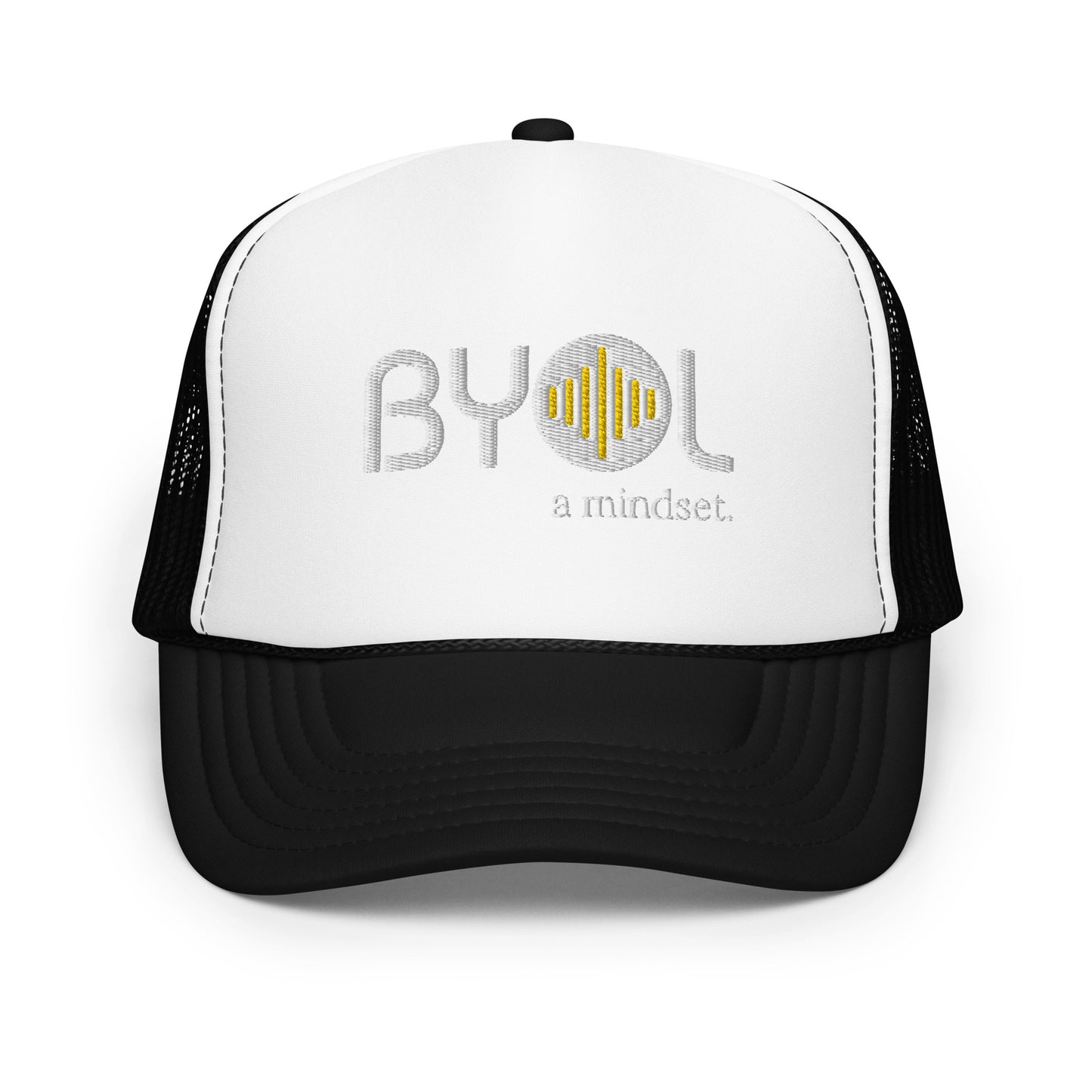 White and black foam trucker hat with "BYOL a mindset" embroidered on the front in gray and yellow, displayed against a clean background. Available in various colors: black, white and blue, blue, pink, and white.