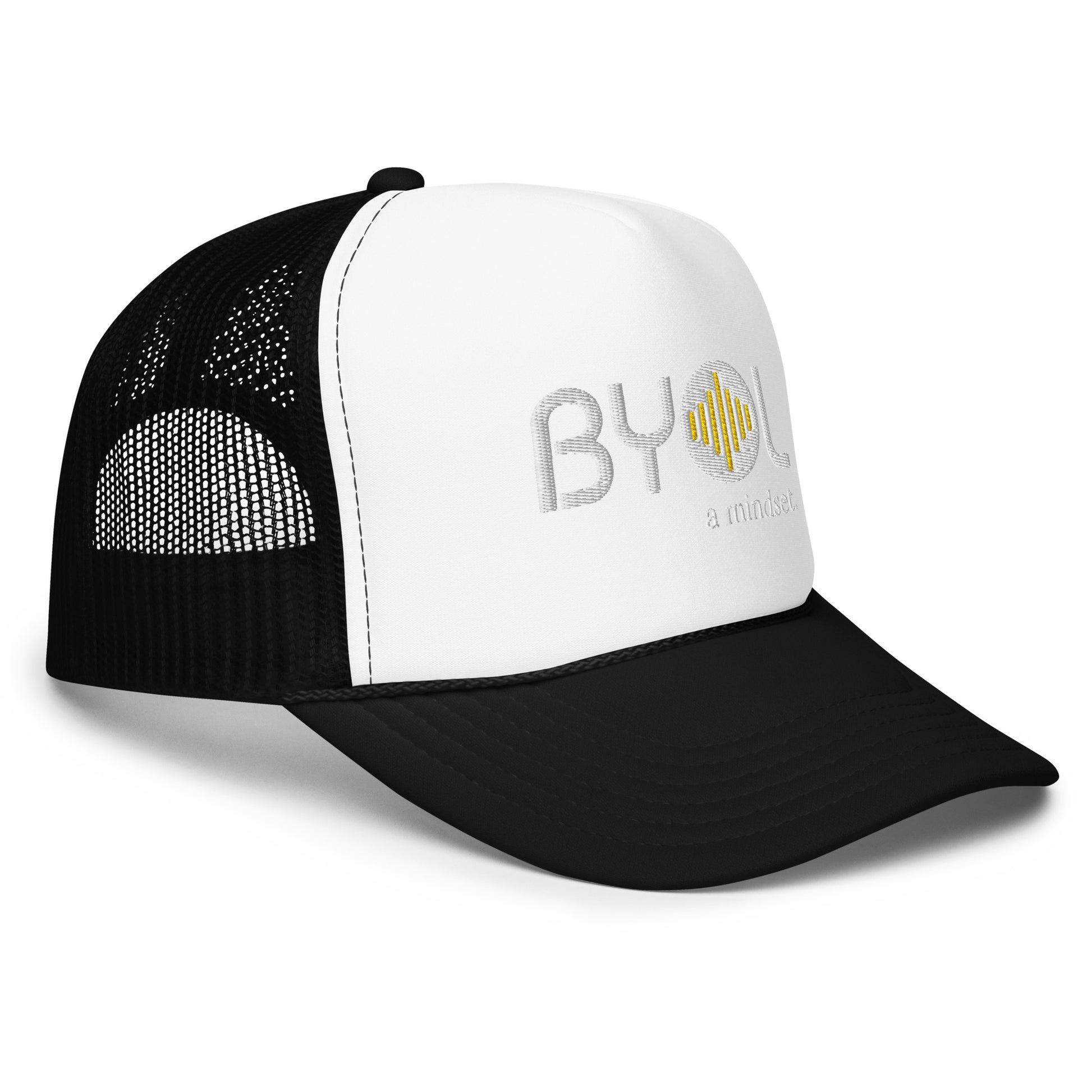 Side of white and black foam trucker hat with "BYOL a mindset" embroidered on the front in white and yellow, featuring a black mesh back, displayed against a clean background. Available in various colors: black, white and blue, blue, pink, and white.