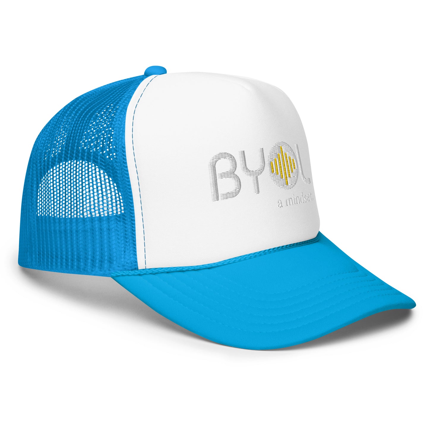 Side of white and blue foam trucker hat with "BYOL a mindset" embroidered on the front in white and yellow, featuring a black mesh back, displayed against a clean background. Available in various colors: black, white and blue, blue, pink, and white.