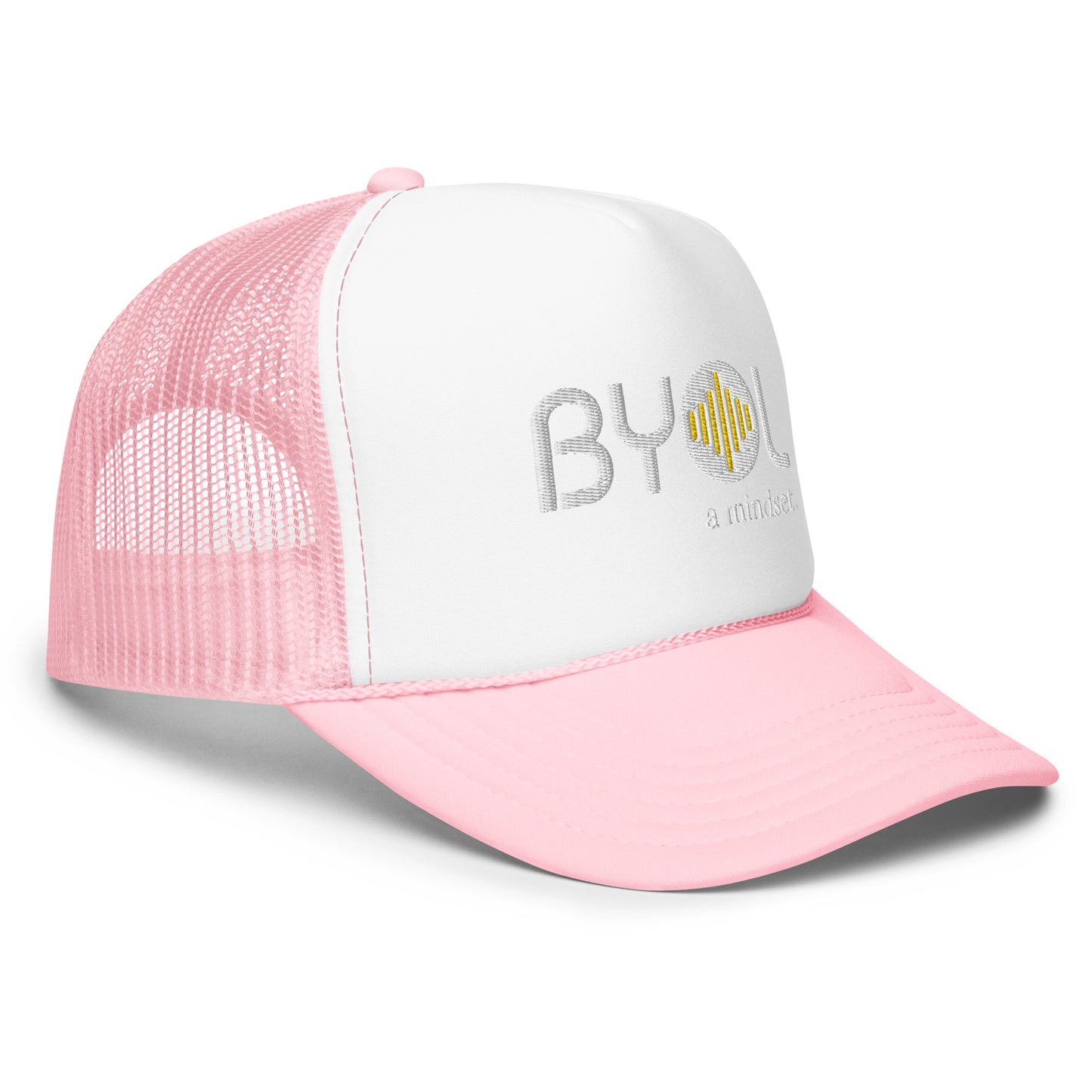 Side of white and pink foam trucker hat with "BYOL a mindset" embroidered on the front in white and yellow, featuring a black mesh back, displayed against a clean background. Available in various colors: black, white and blue, blue, pink, and white.