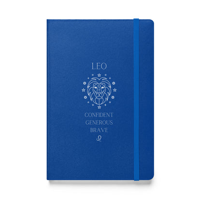 Blue hardcover notebook with the word "low" on top, then an image of a lion followed by three different leo traits and the leo zodiac sign. 