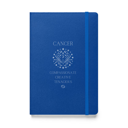 bLUE hardcover notebook that says "cancer" at the top with the an image of the cancer animal followed by three caner traits and the cancer zodiac sign