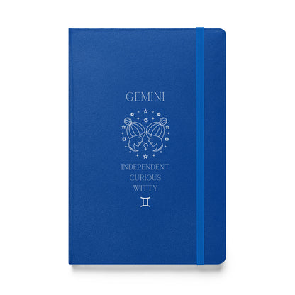 Blue hardcover notebook with the word "Gemini" and an image of two women facing eachother with a list of three characteristics and the gemini zodiac sign