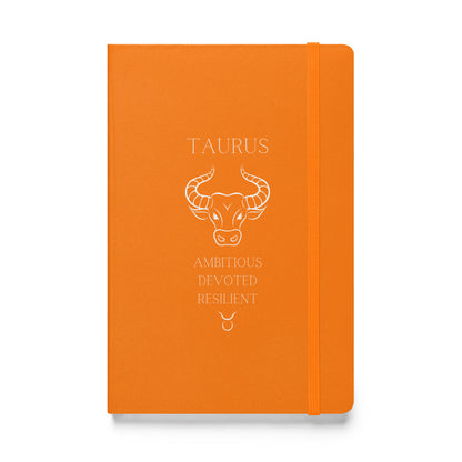 Orange notebook with the word "Taurus" at the top along with the taurus animal, three personality traits and the sign. 