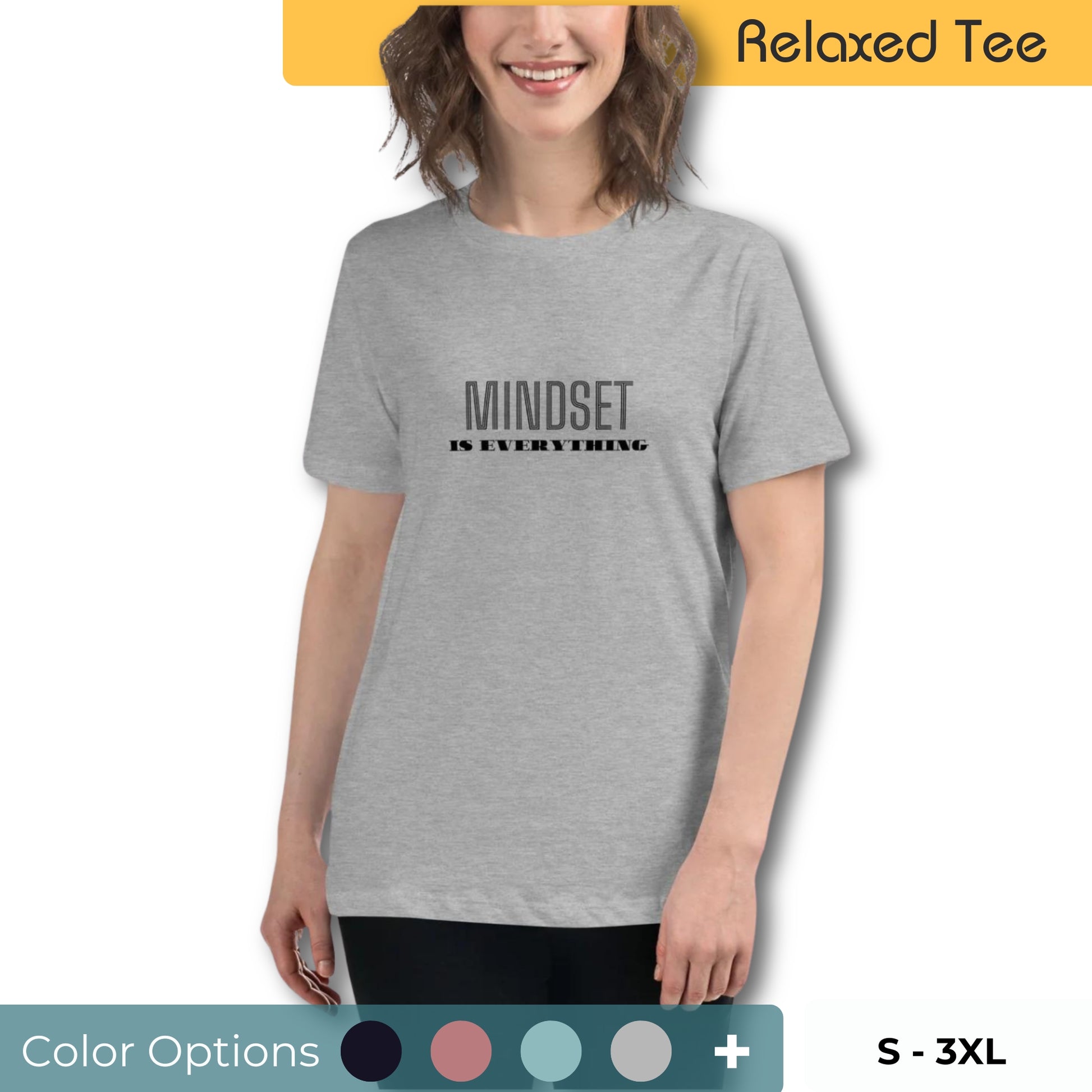 Smiling woman with short wavy hair wearing a relaxed fit light grey tee with 'Mindset is Everything' printed in black, available in multiple colors, sizes S-3XL