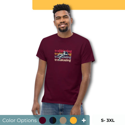 Smiling man in a navy blue classic tee with vibrant 'trailblazing' text, embodying the spirit of boldness and individual trailblazing attitude. Showing the color and size options