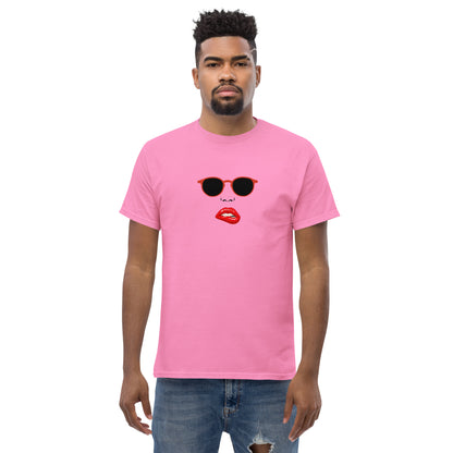 Man wearing a pink classic tee with a quirky red lips and sunglasses graphic, channeling a fun and bold personal style statement.