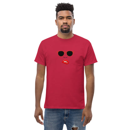 Man wearing a cardinal red classic tee with a quirky red lips and sunglasses graphic, channeling a fun and bold personal style statement.