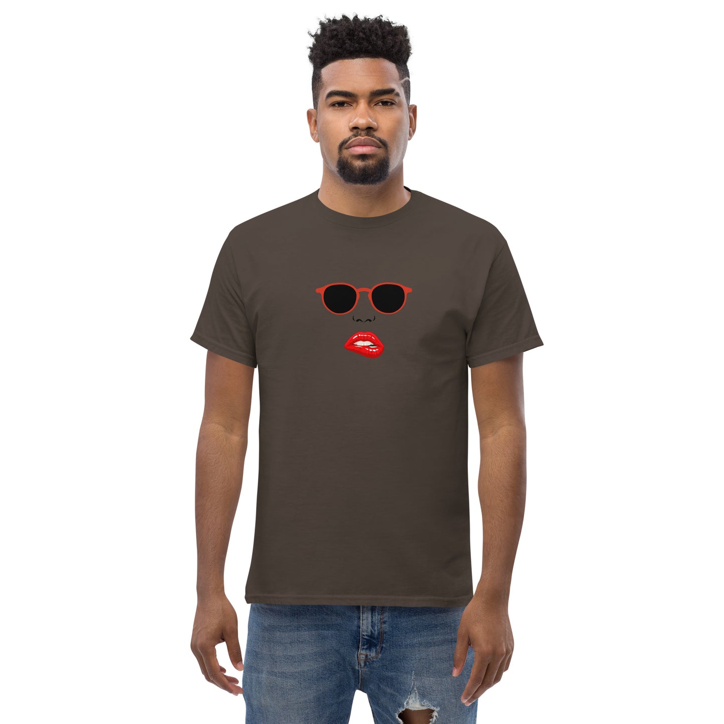 Man wearing a chocolate brown classic tee with a quirky red lips and sunglasses graphic, channeling a fun and bold personal style statement.