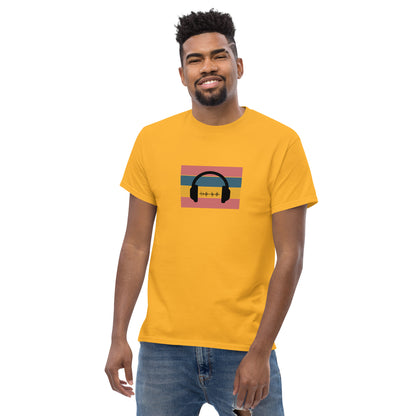 Man smiling in a yellow classic tee featuring a sunset and skyline design with 'Life Is Good' text, symbolizing optimism and bold living.