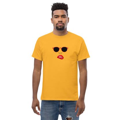 Man wearing a yellow classic tee with a quirky red lips and sunglasses graphic, channeling a fun and bold personal style statement.