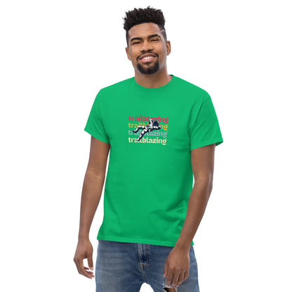 Smiling man in a irish green classic tee with vibrant 'trailblazing' text, embodying the spirit of boldness and individual trailblazing attitude.