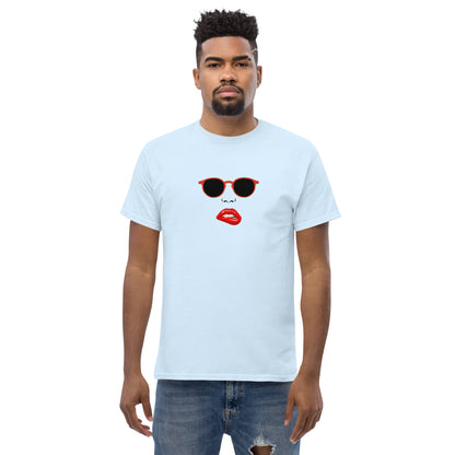 Man wearing a light blue classic tee with a quirky red lips and sunglasses graphic, channeling a fun and bold personal style statement.