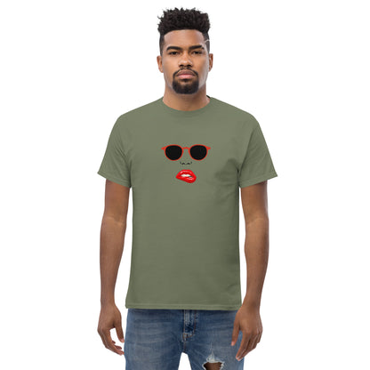 Man wearing a military green classic tee with a quirky red lips and sunglasses graphic, channeling a fun and bold personal style statement.