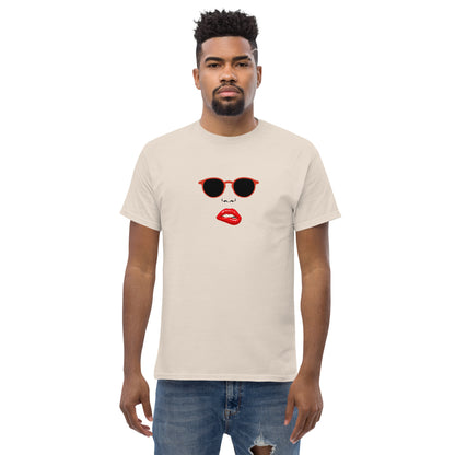 Man wearing a sand classic tee with a quirky red lips and sunglasses graphic, channeling a fun and bold personal style statement.