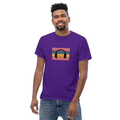 Man smiling in a purple classic tee featuring a sunset and skyline design with 'Life Is Good' text, symbolizing optimism and bold living.