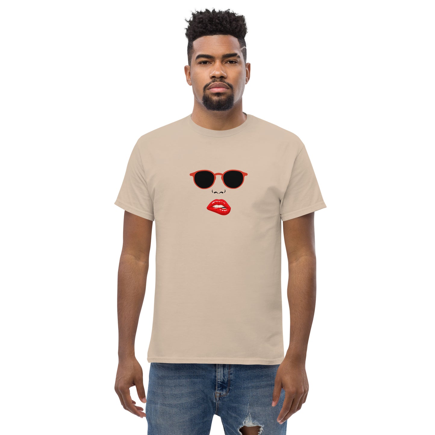 Man wearing a sand classic tee with a quirky red lips and sunglasses graphic, channeling a fun and bold personal style statement.