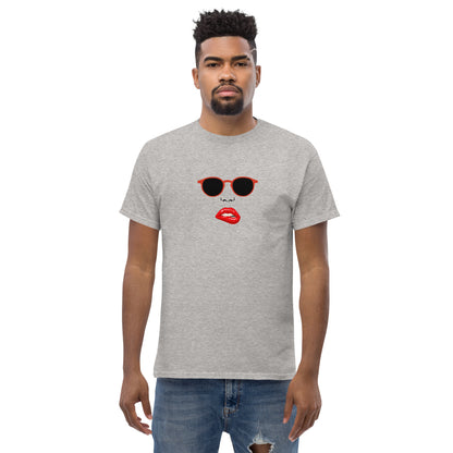 Man wearing a grey classic tee with a quirky red lips and sunglasses graphic, channeling a fun and bold personal style statement.