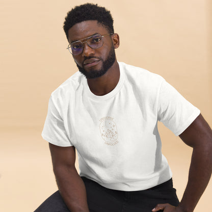 Man in a white tee with a cosmic design saying 'Universe Unfolded', epitomizing bold self-expression.