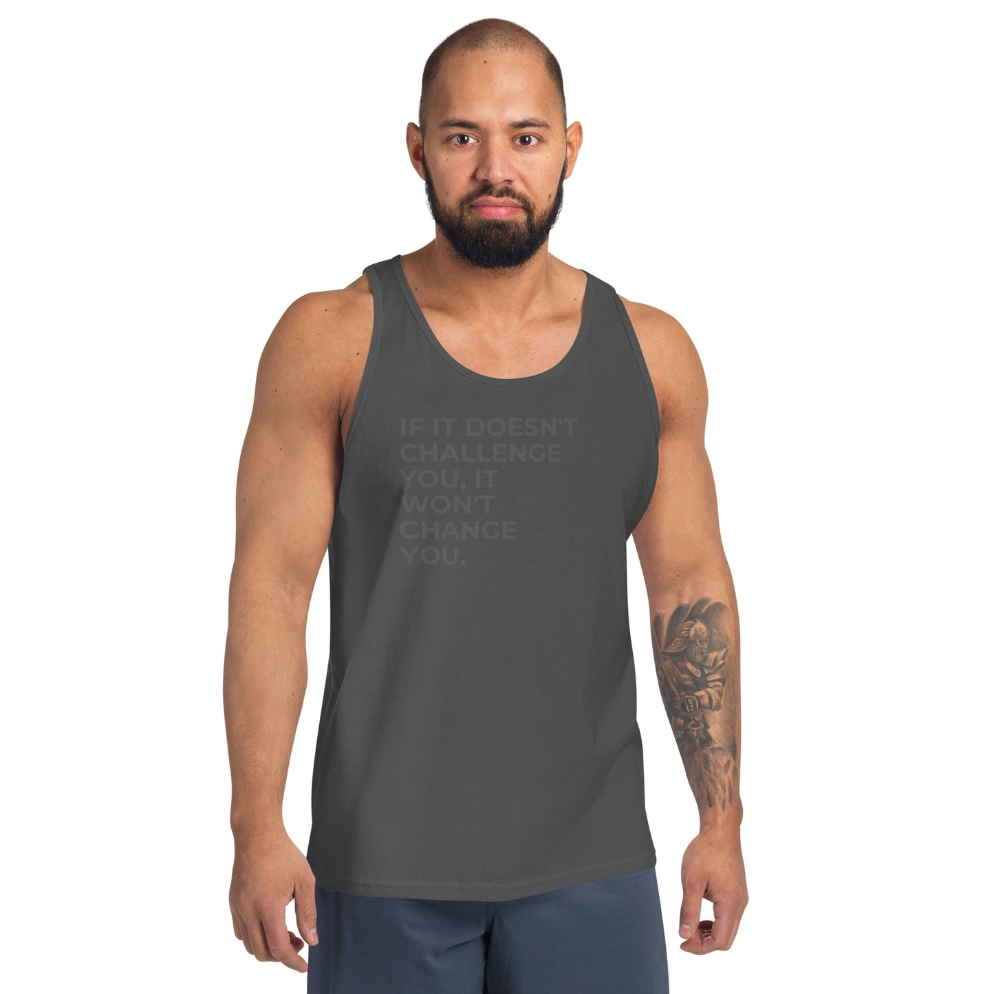 Man wearing an asphalt sleeveless tank with "If It Doesn’t Challenge You, It Won’t Change You" text. 