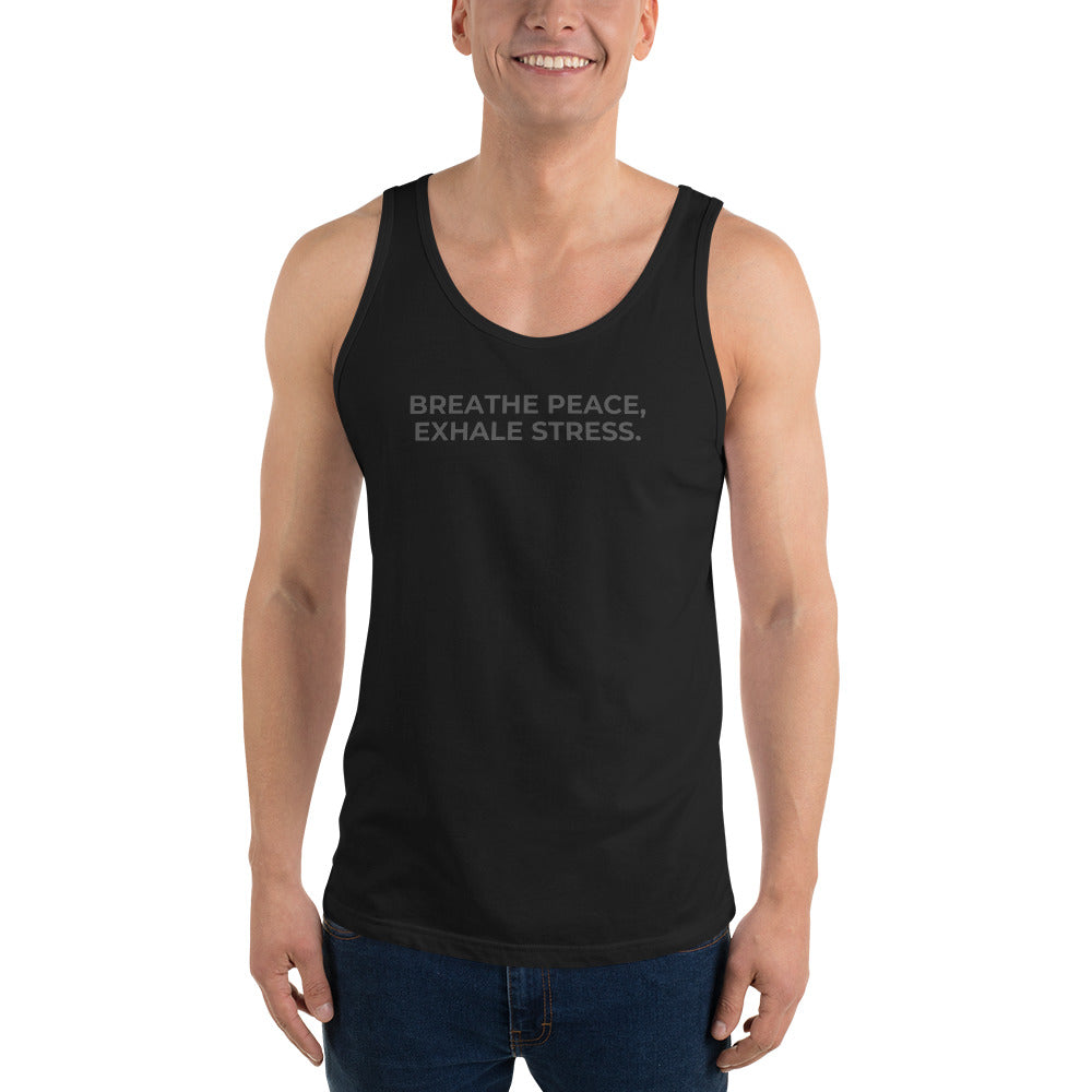 Man wearing a black sleeveless tank with "Breathe Peace, Exhale Stress" text.