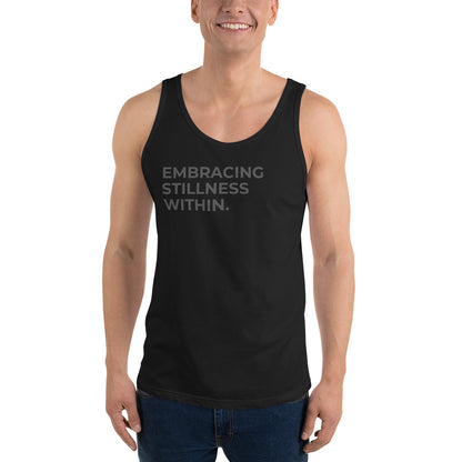 Man wearing a black sleeveless tank with "Embracing Stillness Within" text. 