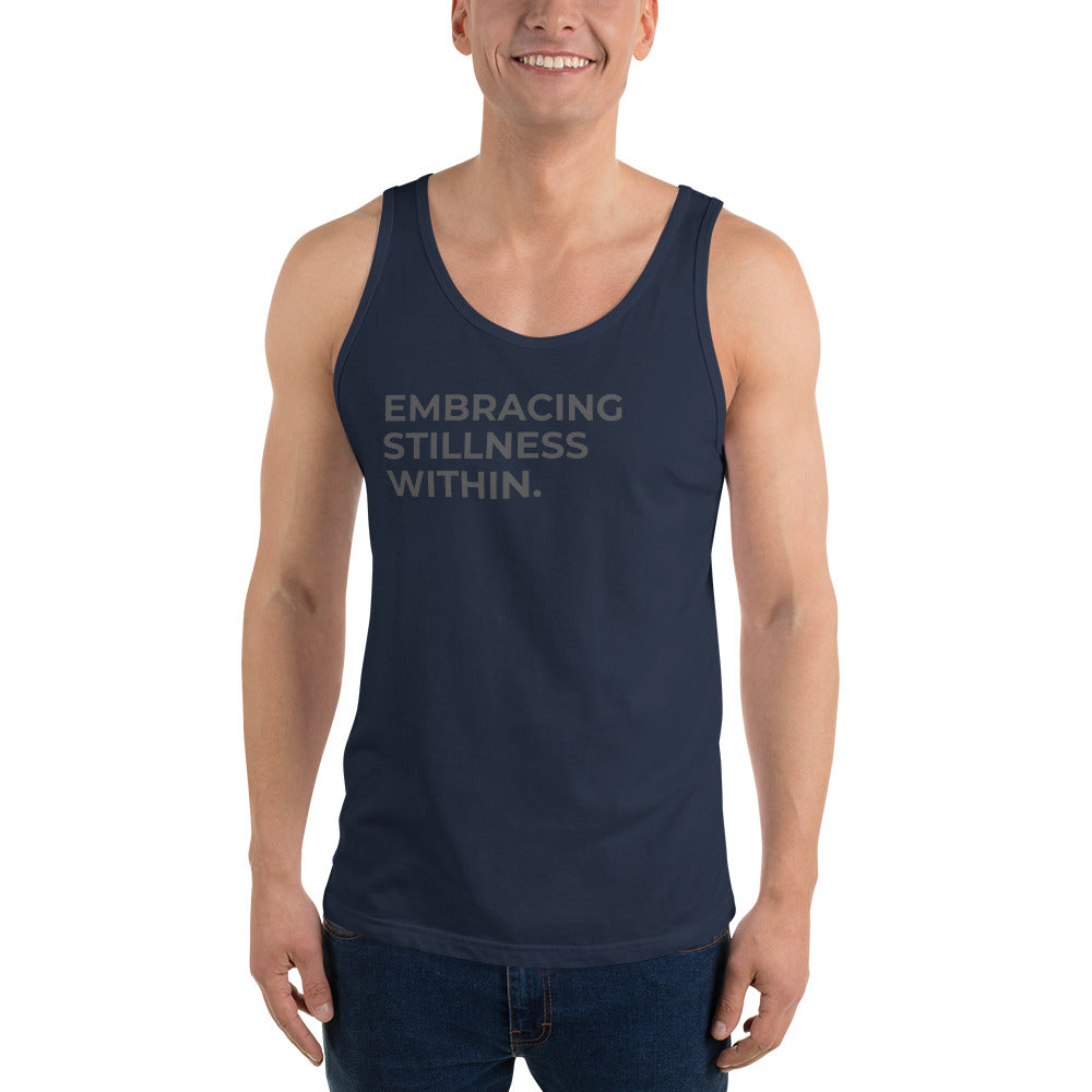 Man wearing a navy sleeveless tank with "Embracing Stillness Within" text. 