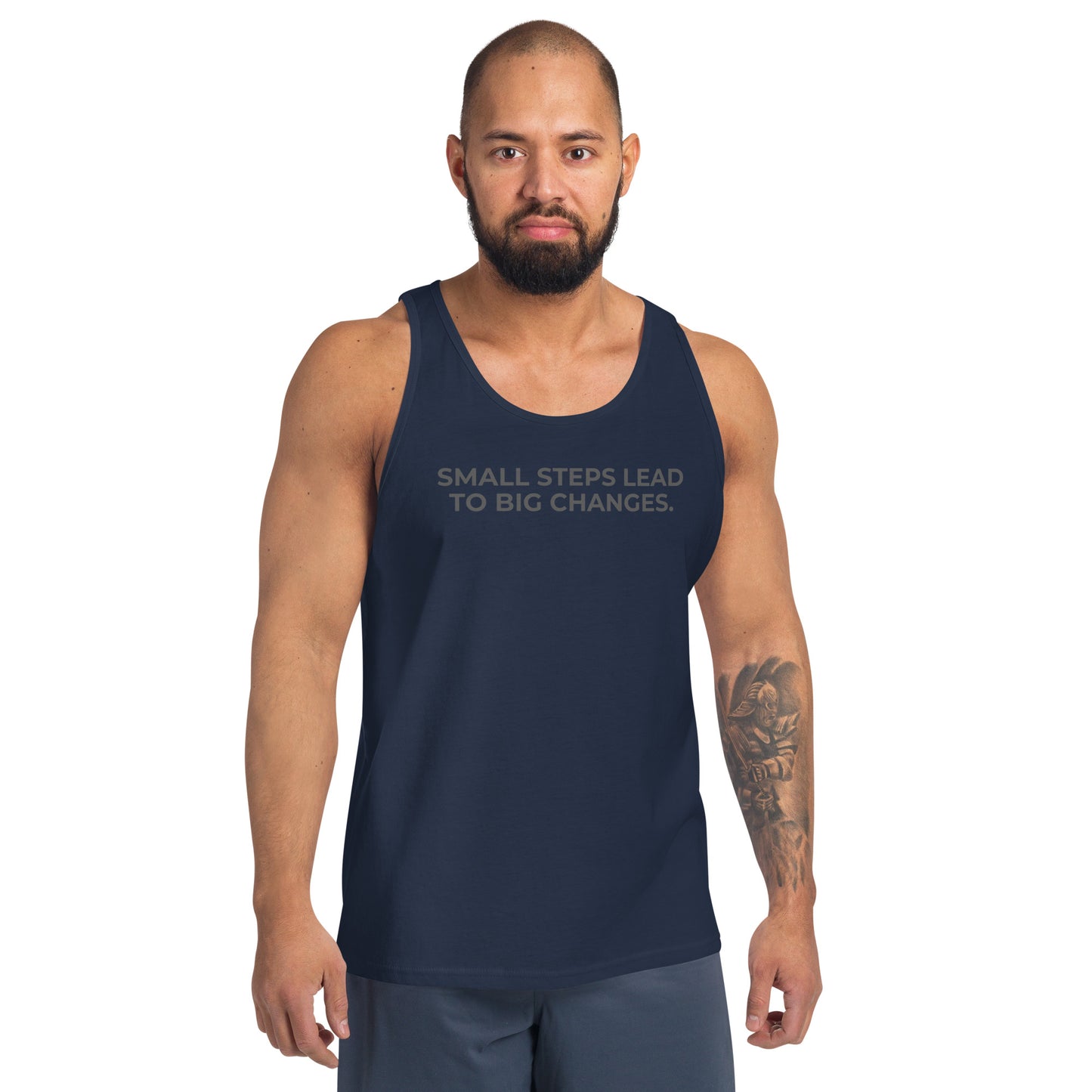 Man wearing a navy sleeveless tank with "Small Steps Lead to Big Changes" text. 